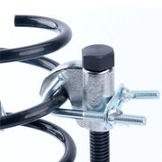 Close-up detail of the forged jaw and safety latch attached to the spring coil.