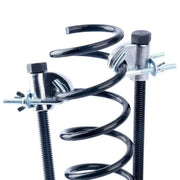 Dual compressors mounted directly onto a black coil spring.