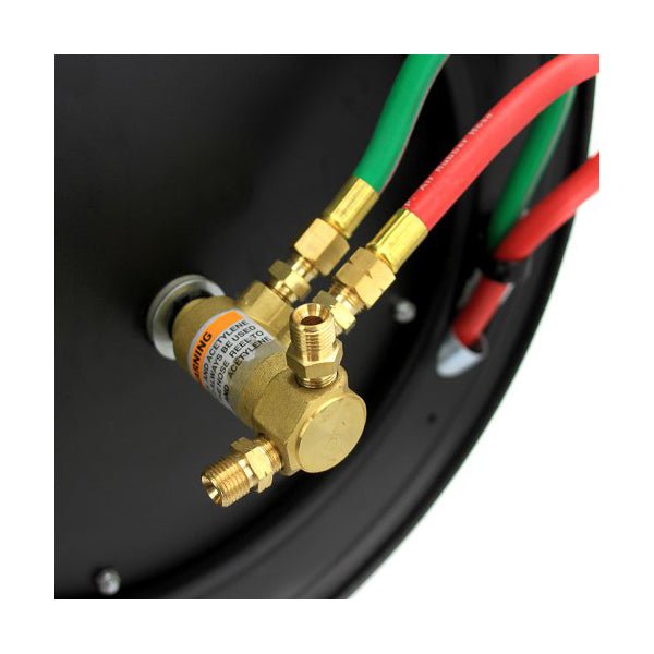 Close-up view of the brass inlet fittings and connection ports on the retractable welding hose reel.