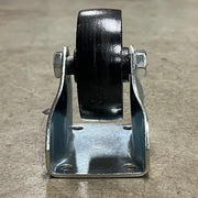 Side profile of the Steelex D4176 fixed caster showing the heavy steel support bracket and cast iron wheel.