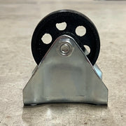 Side profile of the Steelex D4176 fixed caster showing the heavy steel support bracket and cast iron wheel.